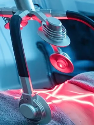 ZENORA laser treatment heads directing red light onto a patient's body