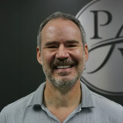 Professional headshot of Dash, a member of the Premier Wellness team